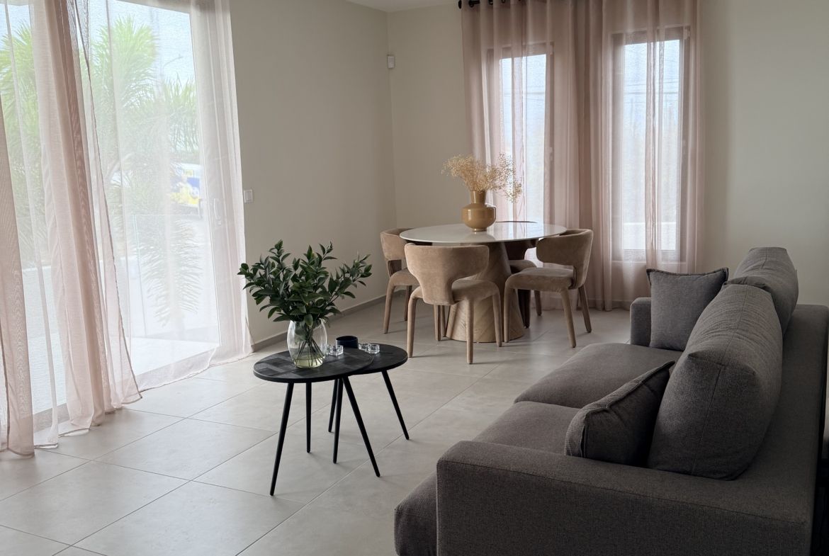 Living and dining area at Perseus Living apartment in Curaçao