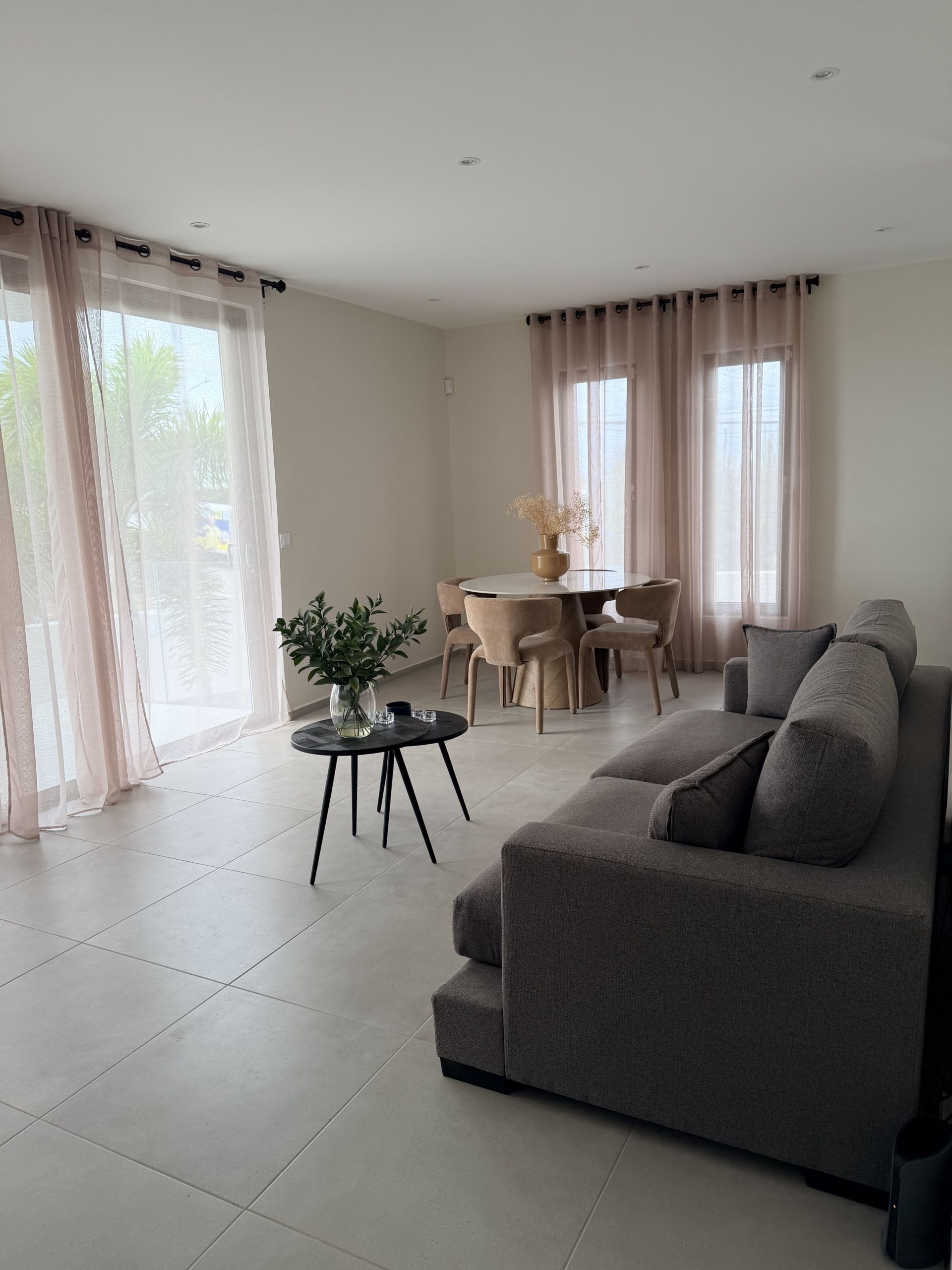 Living and dining area at Perseus Living apartment in Curaçao