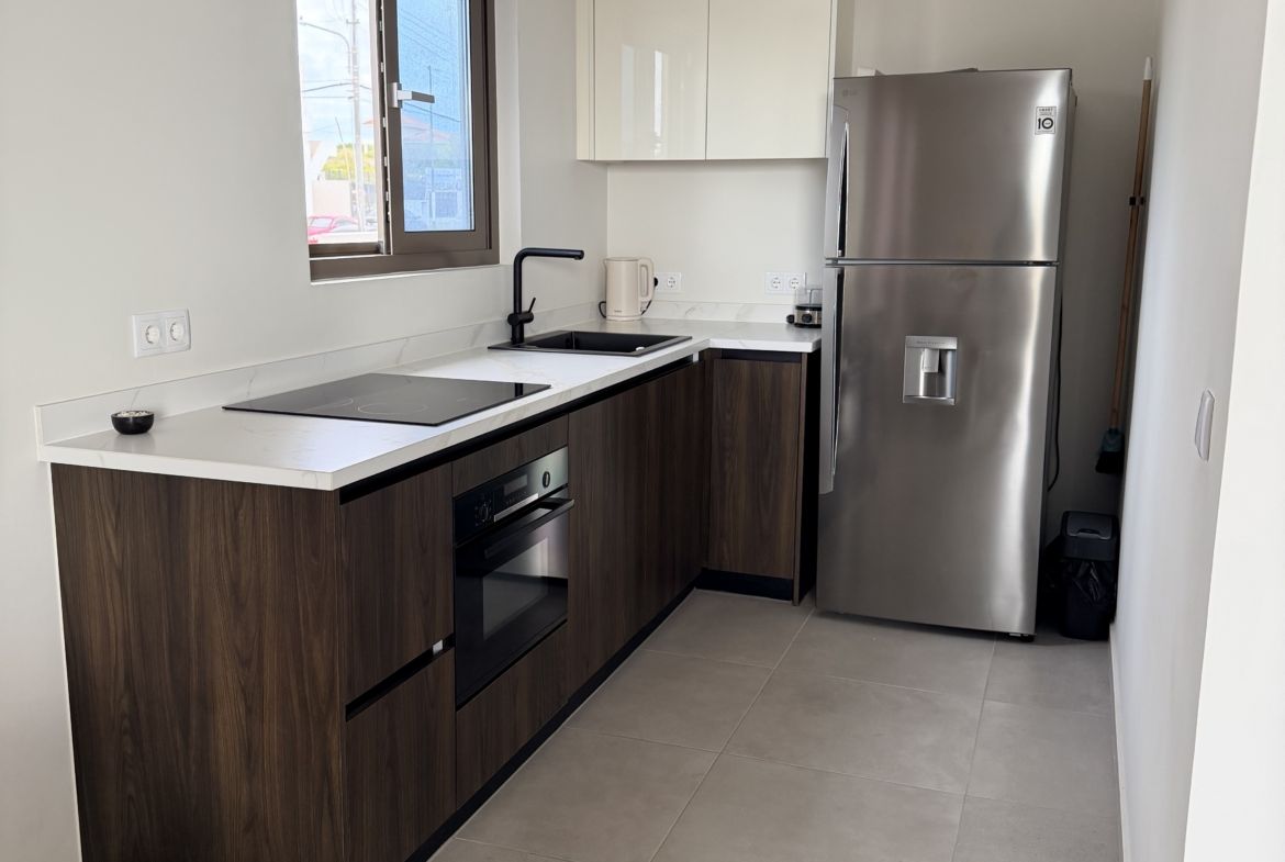 Modern kitchen at Perseus Living apartment in Curaçao