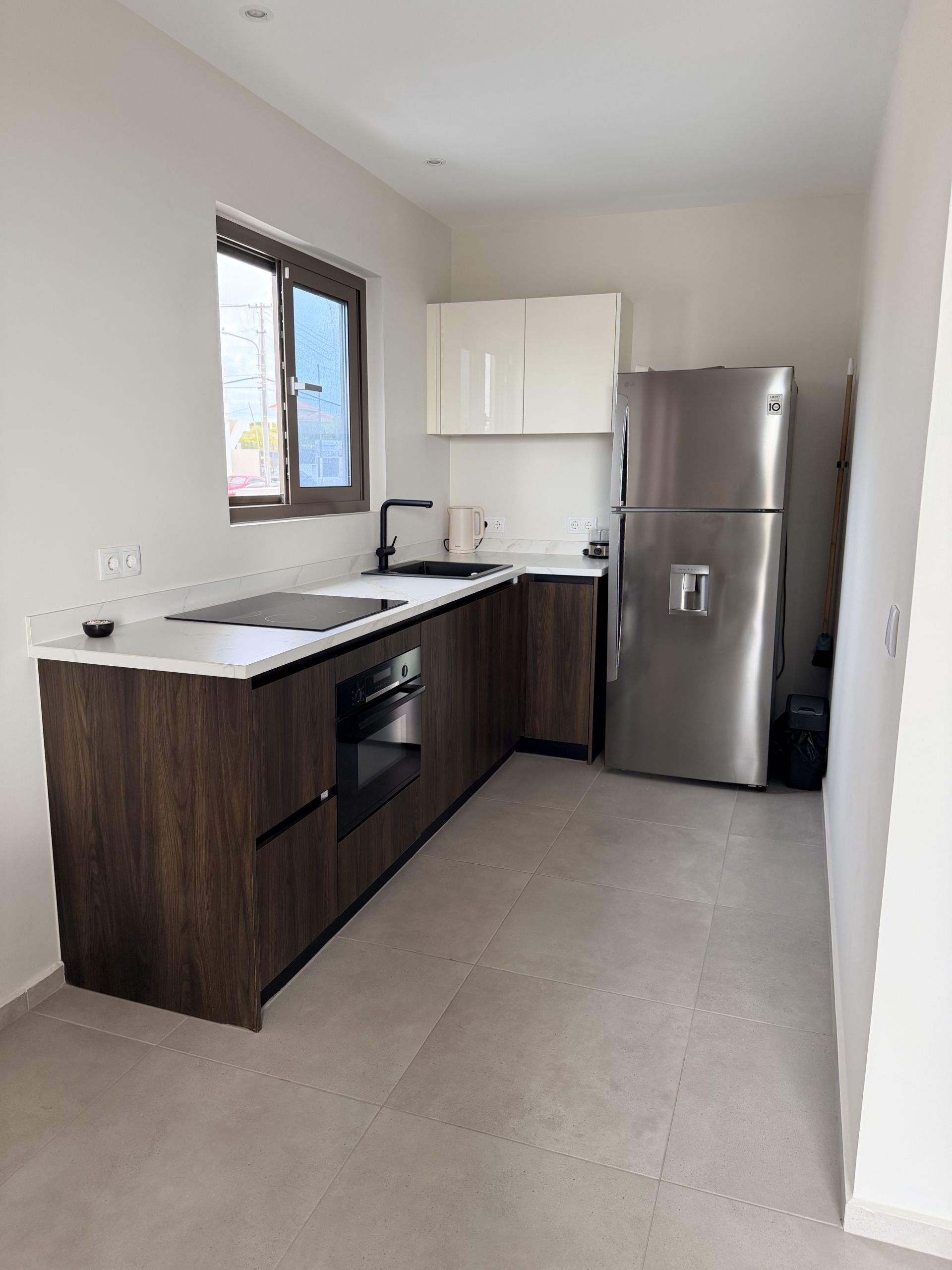 Modern kitchen at Perseus Living apartment in Curaçao